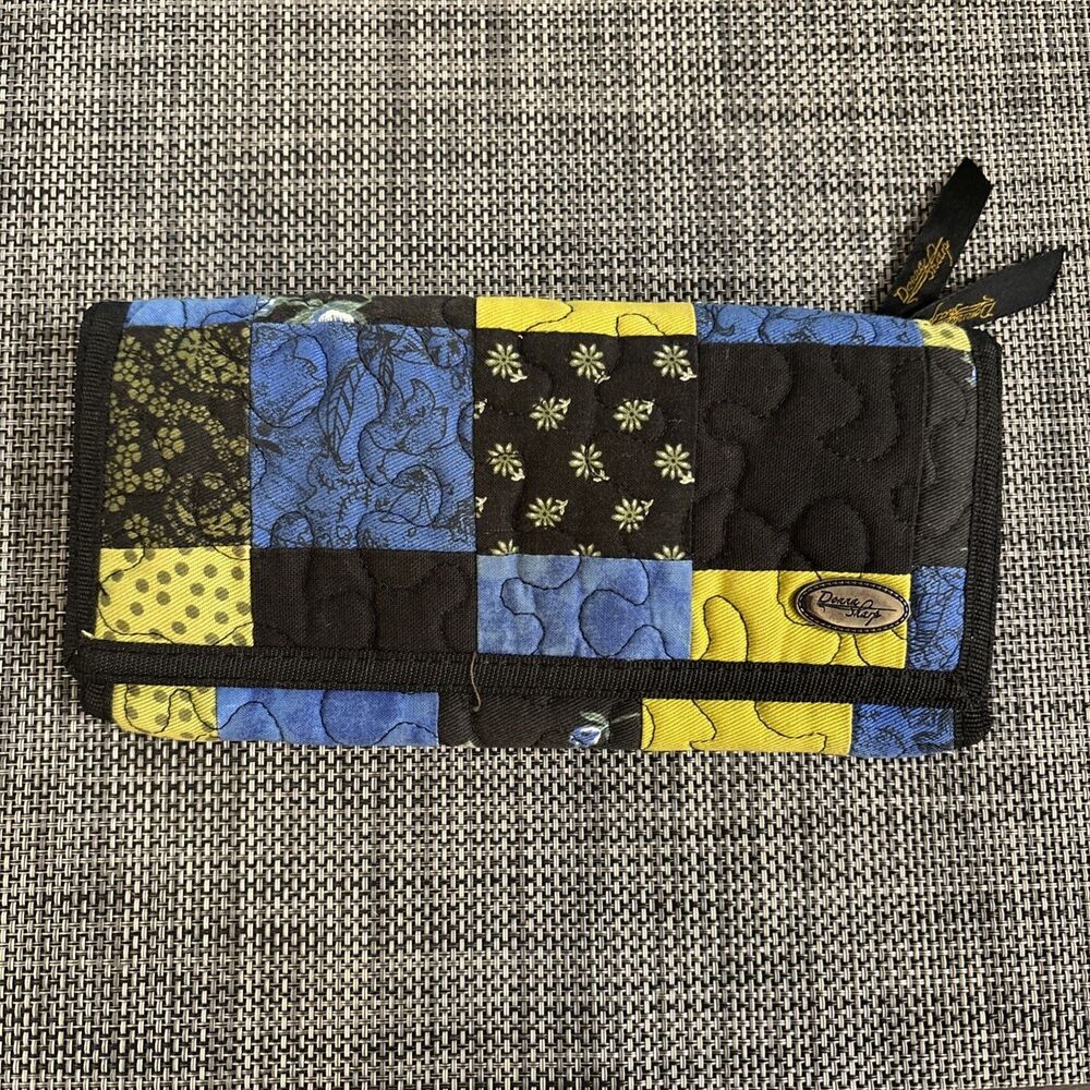 Donna Sharp quilted wallet In blue, black, and yellow patchwork pattern 8”x4”
